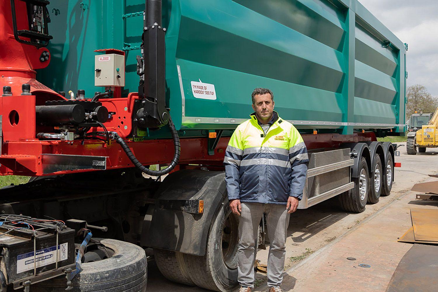 Man next to green M. Torre truck