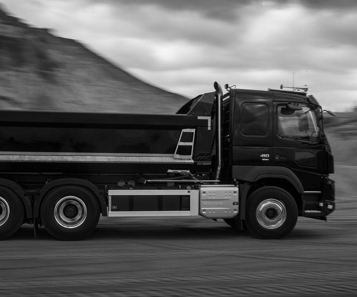 Black and white image of a moving truck.