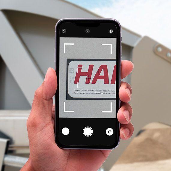 Smartphone scanning a Hardox® In My Body QR code.